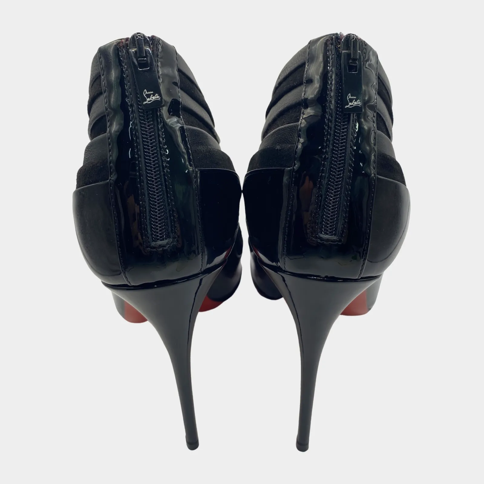 Christian Louboutin low cut black suede ankle boots with patent leather bottom panel